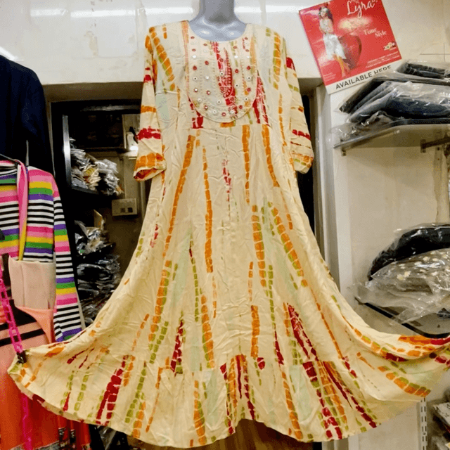 Cream base with vertical stripes in shades of red, orange, and green Dress