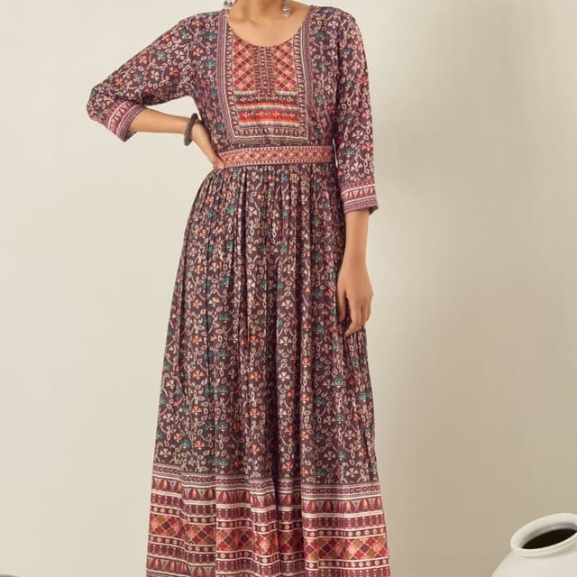 Brown, with accents of red, orange, green, and blue. Dress