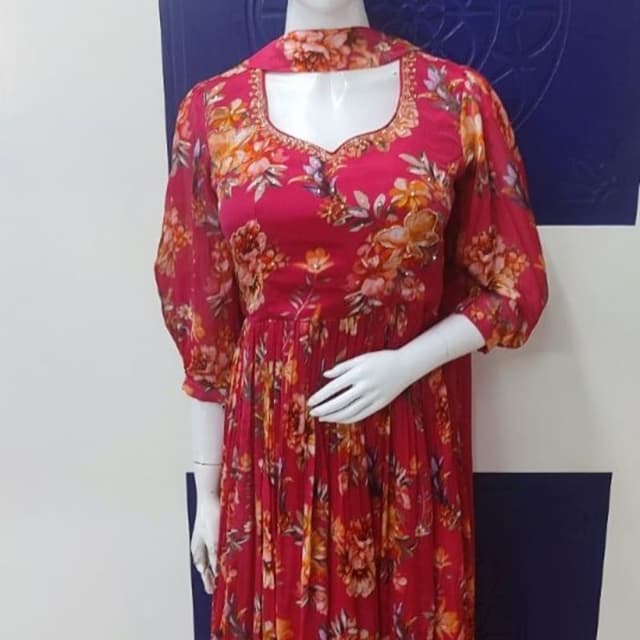 Red, orange, yellow, and green floral print on a red background Dress