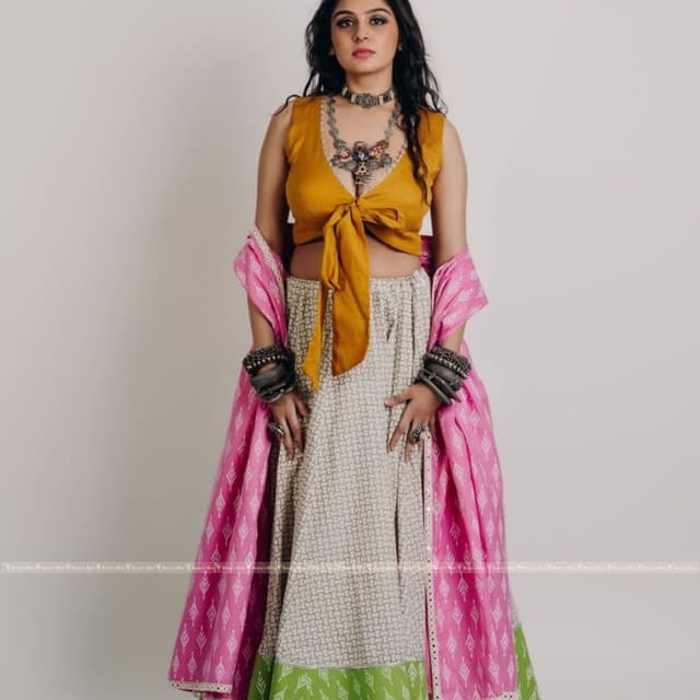 Mustard yellow, pink, green, and off-white Lehenga Choli