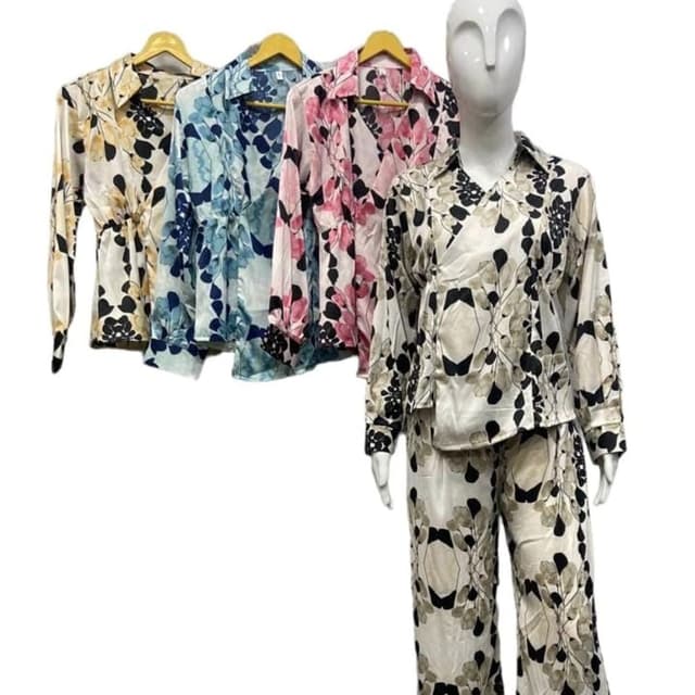 Various floral patterns on a white or light-colored background. Includes combinations of yellow and black, blue and white, and pink and black. Pajama Set