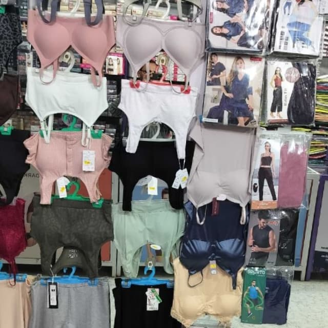 Various, including Pink, White, Black, Beige, Gray, and Blue Bras, Briefs, and Shapewear