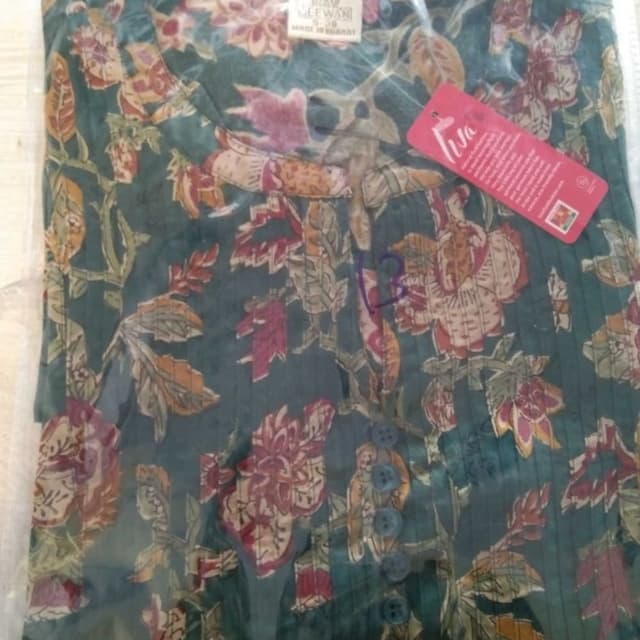 Green, with floral patterns in shades of red, orange, and beige Dress