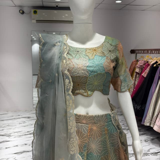 Pastel shades of blue, peach, and gold Lehenga Choli