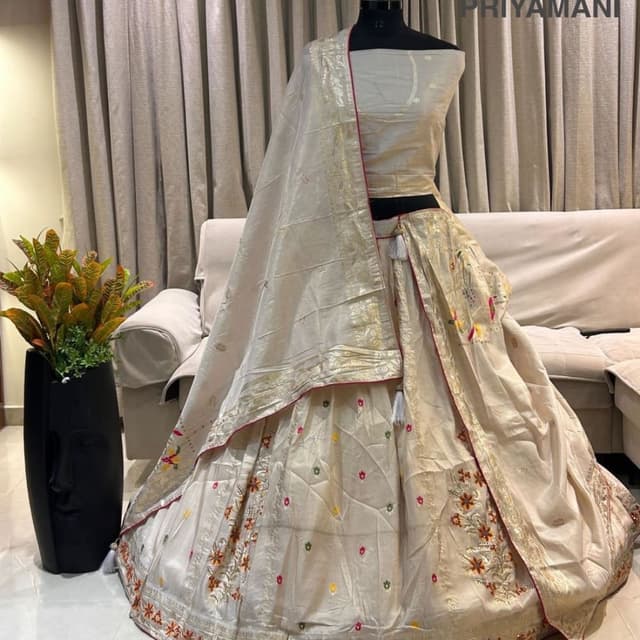 Ivory, Gold, Red, and Multi-colored embroidery Lehenga Choli