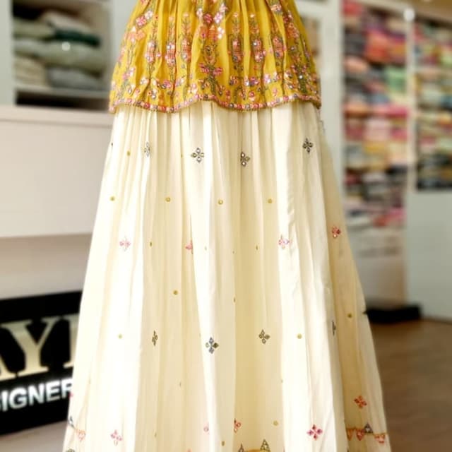 Mustard yellow and cream with multicolor accents Lehenga