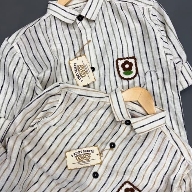 White, Black, Brown, Green Shirt