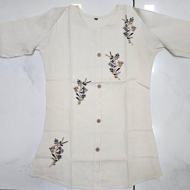 Off-White with accents of Blue, Yellow, and Green Top