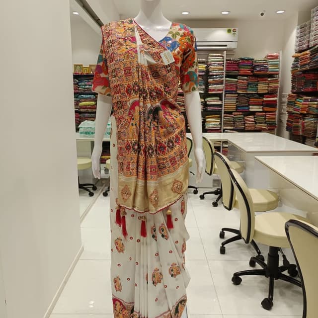 White, Beige, Orange, Red, and Multi-colored accents Saree