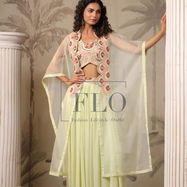 Pastel green, peach, off-white, and red Lehenga Choli with jacket and sheer cape