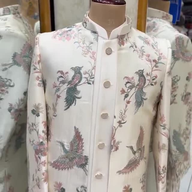 Ivory, with accents of pink, green, and gray Jacket