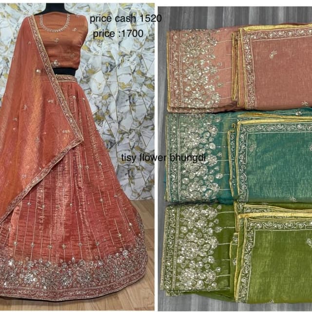 Red, orange, green, and a variety of gold and silver embellishments Lehenga Choli