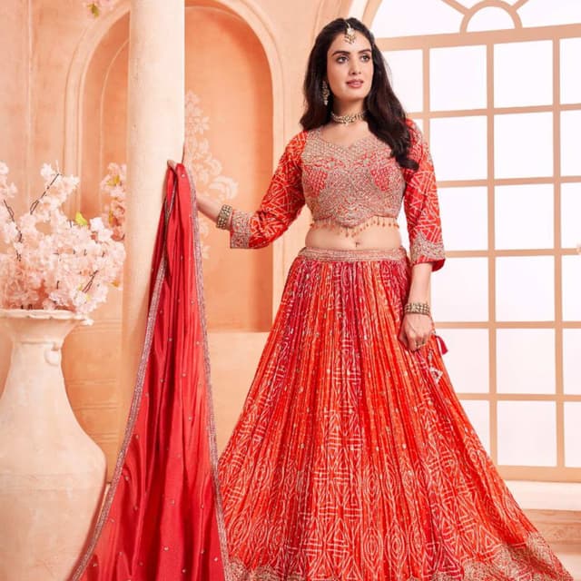 Red, orange, and gold Lehenga Choli
