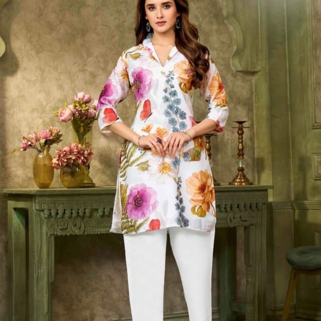White, with a vibrant floral print in shades of pink, orange, blue, and green Kurti and Pants Set