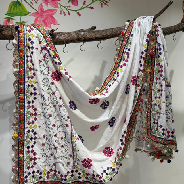 White with a vibrant mix of colors including red, pink, blue, green, and yellow. Shawl/Dupatta