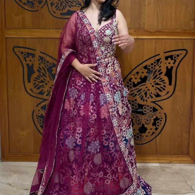 Burgundy, with floral patterns in various shades including pink, white, blue, and orange Lehenga Choli